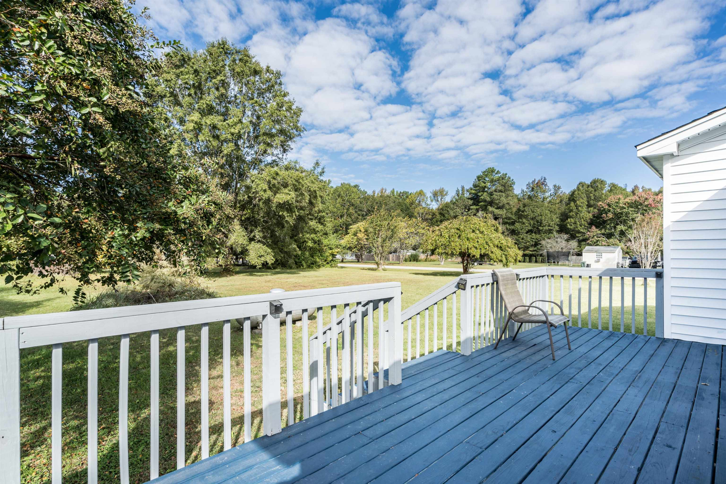 429 Government Road Clayton, NC 27520 - Photo 21 of 27 a view of balcony with wooden floor and fence