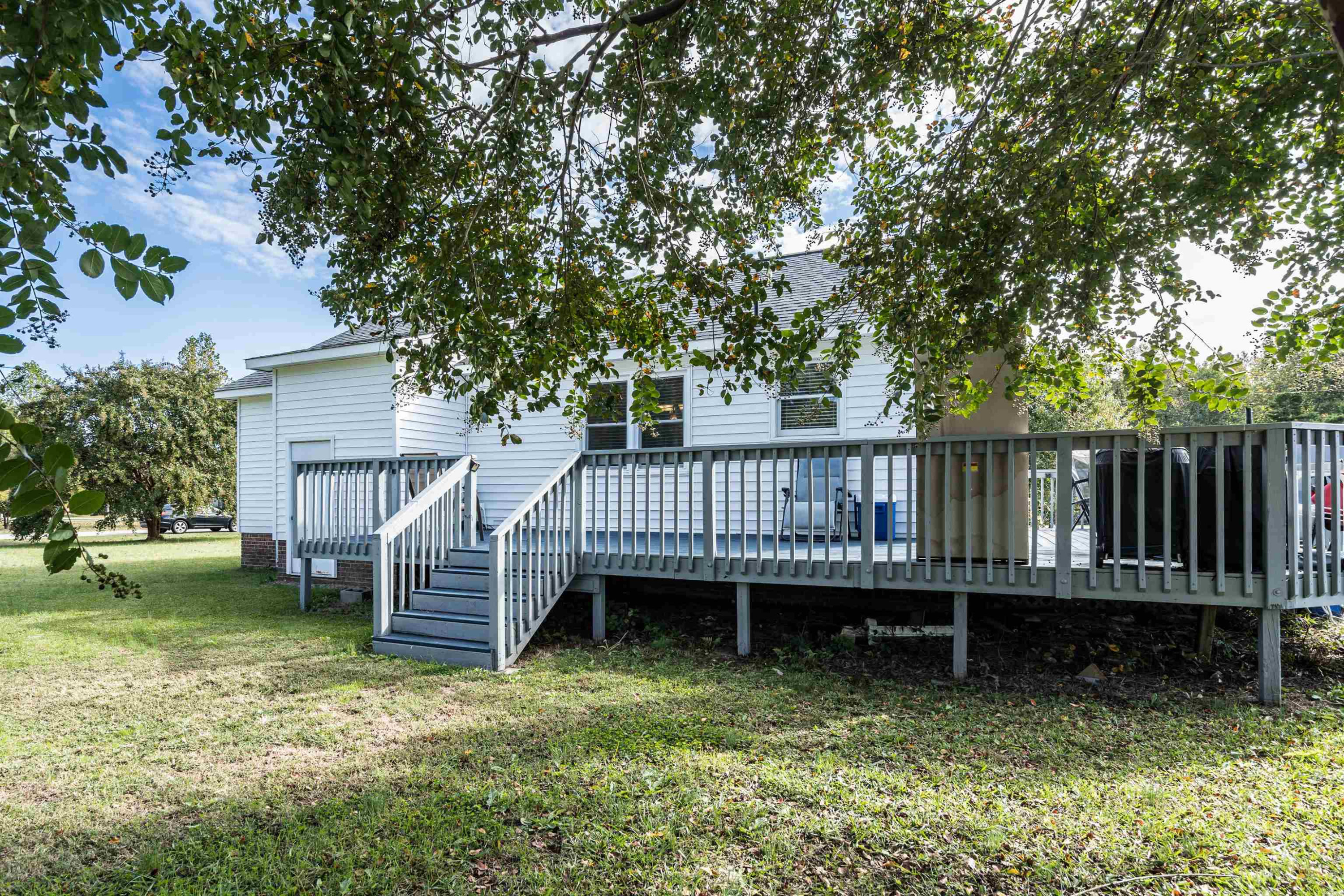 429 Government Road Clayton, NC 27520 - Photo 23 of 27 a view of a house with a deck and a yard