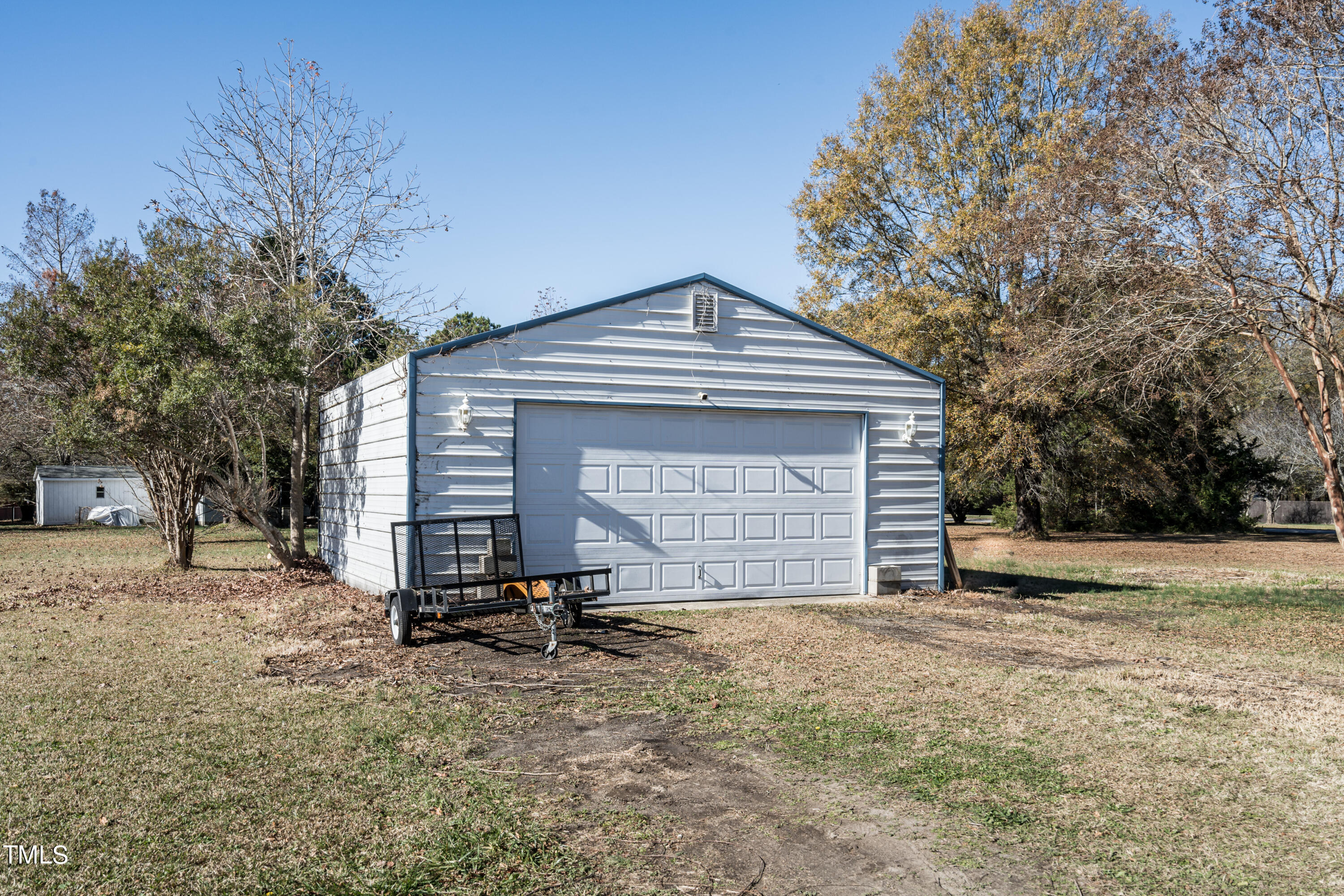 429 Government Road Clayton, NC 27520 - Photo 24 of 27 a front view of a house with a yard