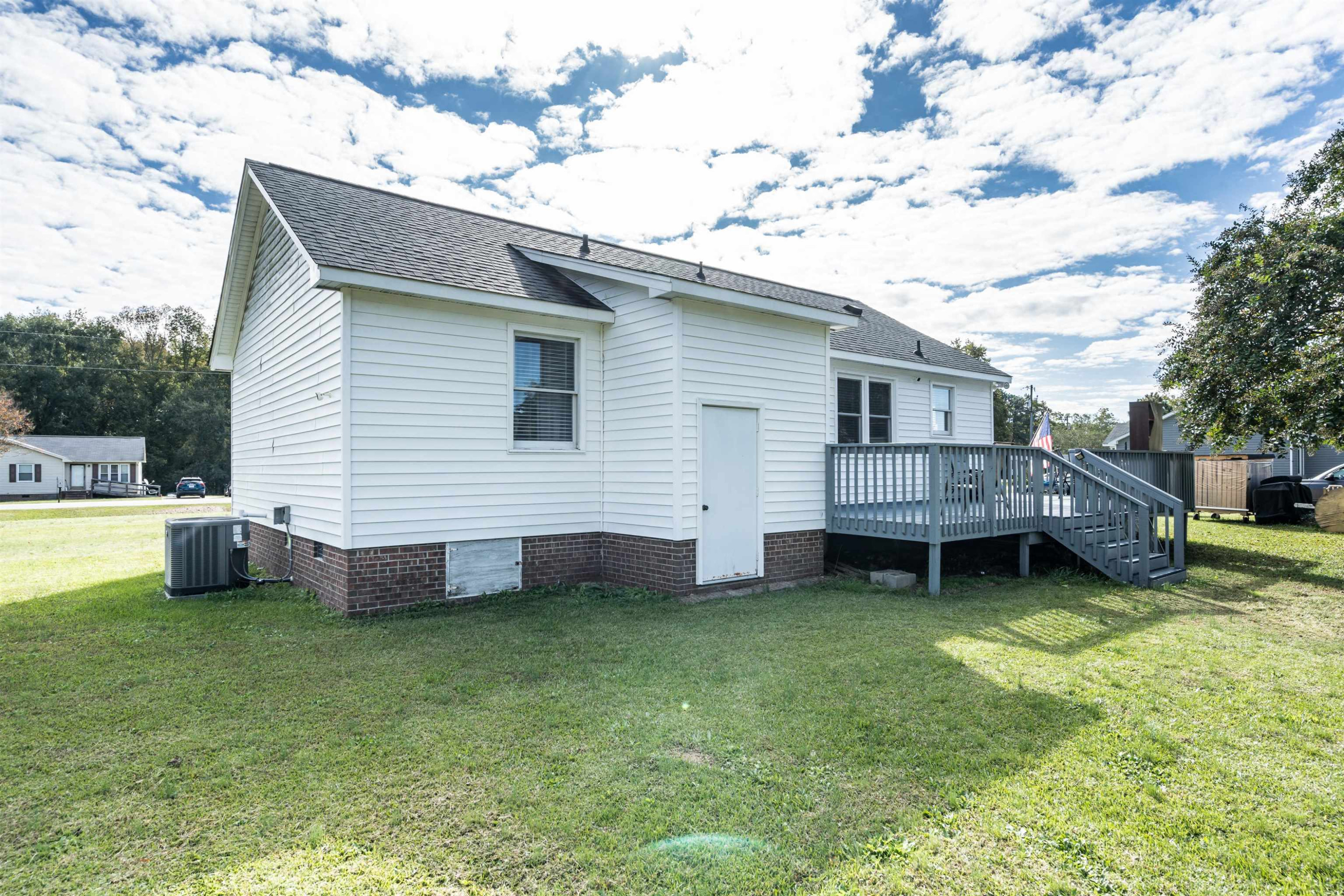 429 Government Road Clayton, NC 27520 - Photo 26 of 27 a view of a house with a yard and sitting area