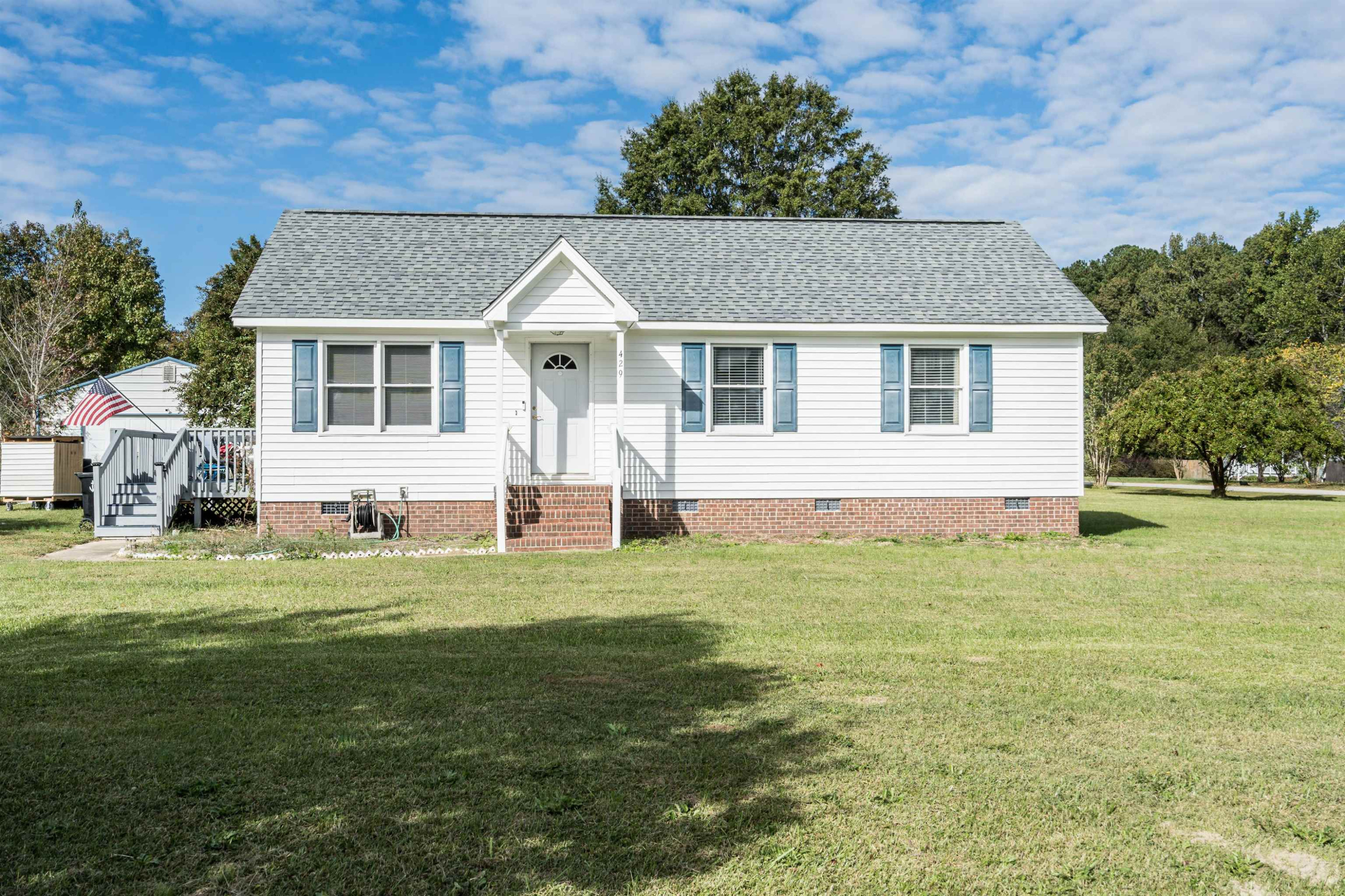 429 Government Road Clayton, NC 27520 - Photo 27 of 27 a front view of a house with a garden