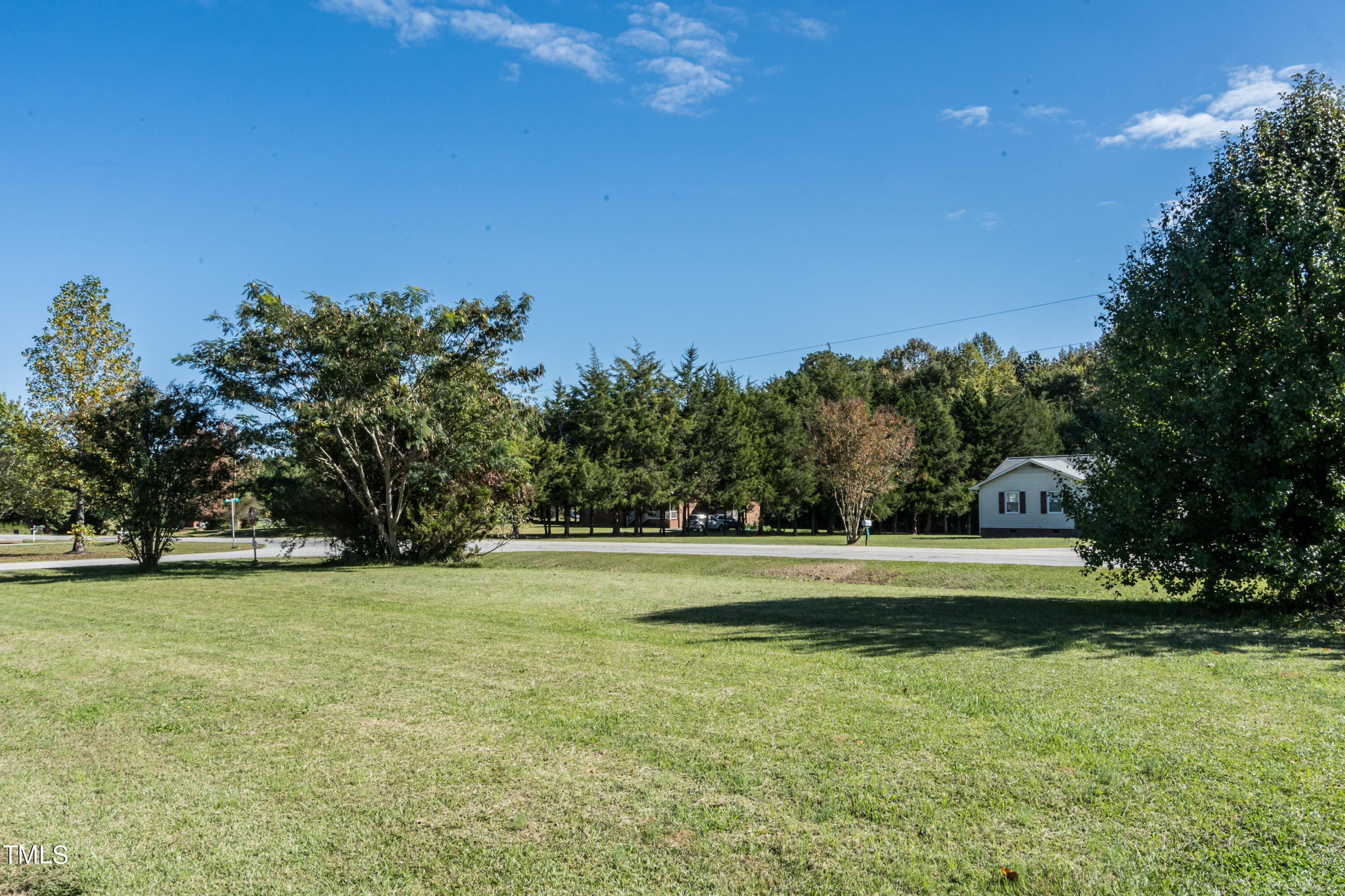 429 Government Road Clayton, NC 27520 - Photo 5 of 27 a view of a golf course with a lake