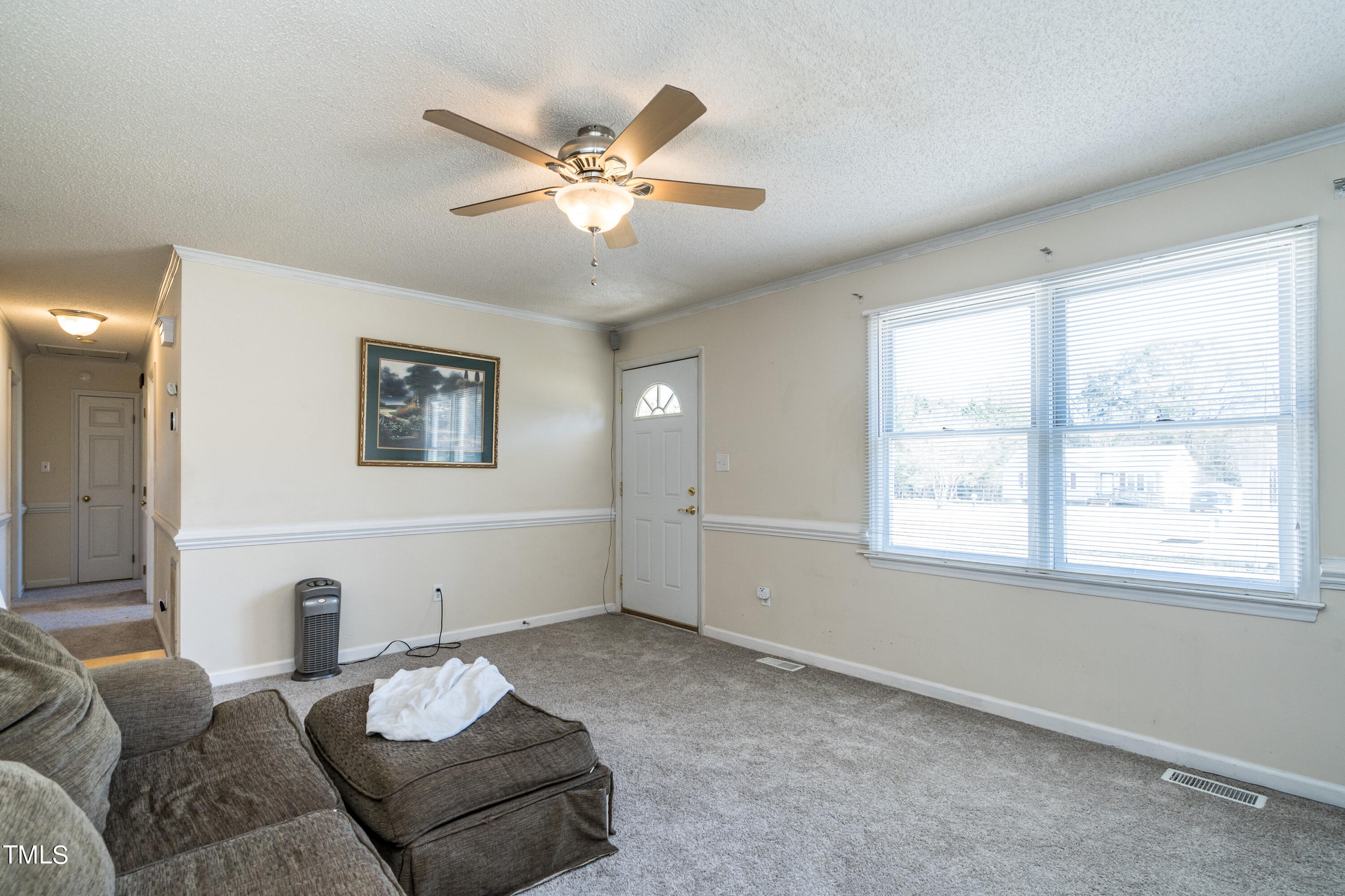 429 Government Road Clayton, NC 27520 - Photo 8 of 27 a living room with furniture and a window
