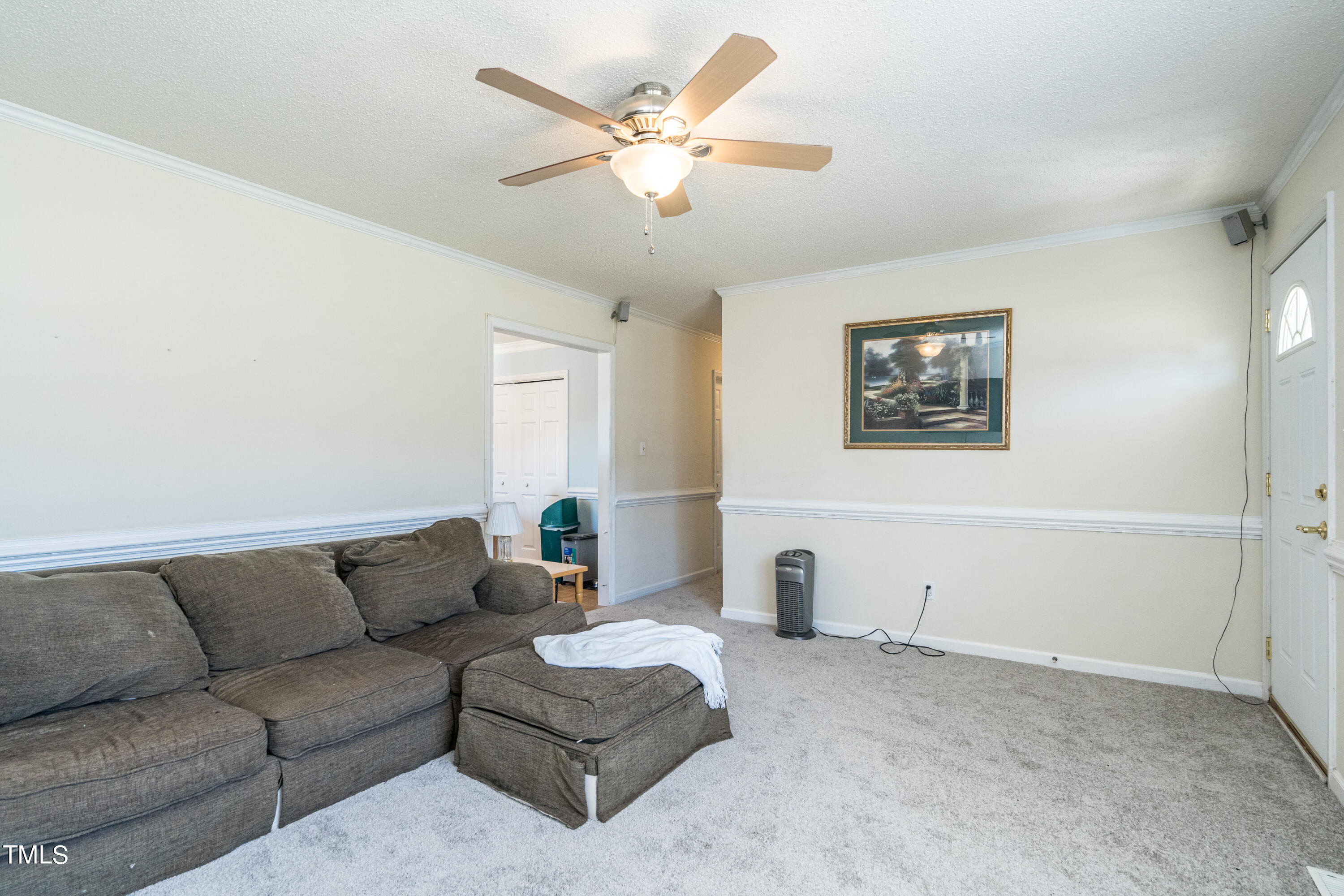 429 Government Road Clayton, NC 27520 - Photo 9 of 27 a living room with furniture and a ceiling fan
