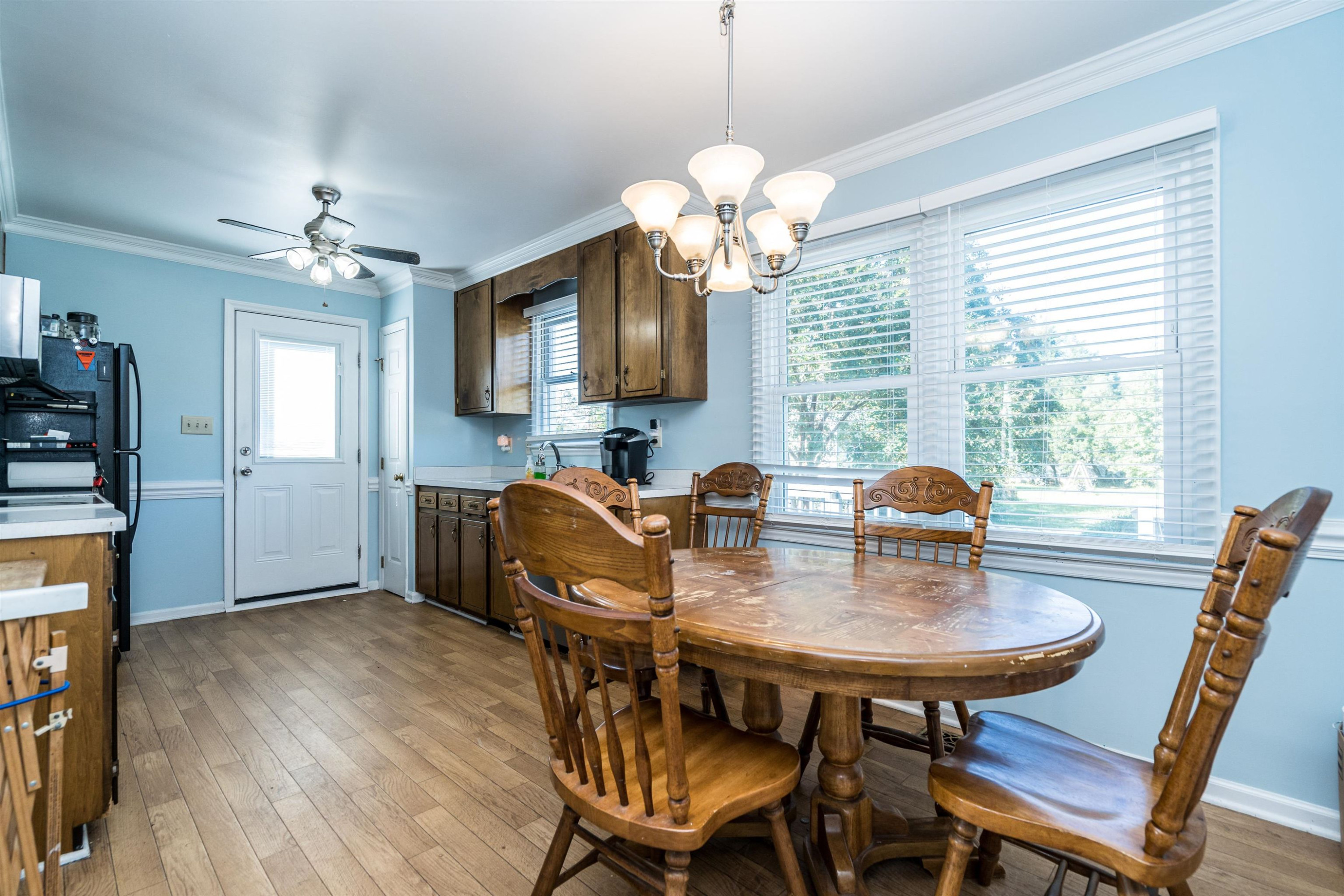 429 Government Road Clayton, NC 27520 - Photo 10 of 27 a view of a dining room with furniture window and wooden floor