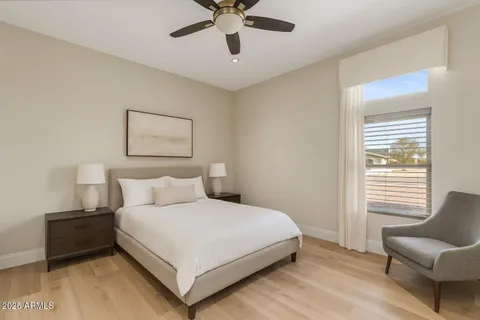 a bedroom with a bed and window