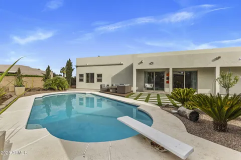 a view of a house with swimming pool