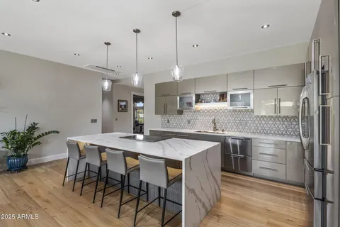 a kitchen with a table and chairs in it