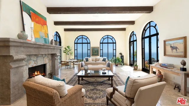 a view of living room with furniture and wooden floor