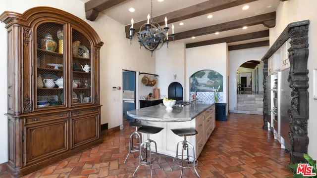 a living room with furniture pool table and a large window