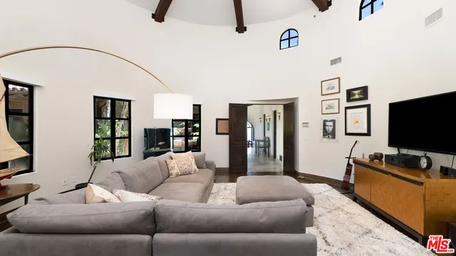 a spacious bathroom with a granite countertop sink a mirror and a bathtub