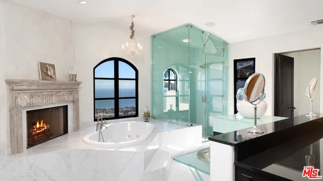 a view of a room with table and chairs