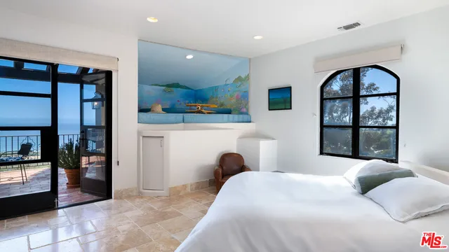 a view of a balcony with furniture and city view