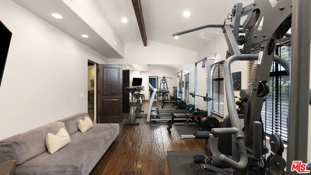 a bathroom with a toilet a sink and a mirror