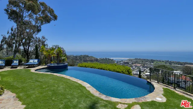 a view of a house with a yard and garage