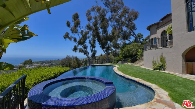 a view of a backyard of the house