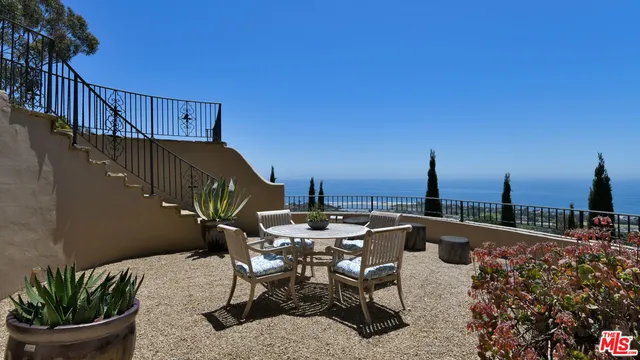 a view of a balcony with chairs