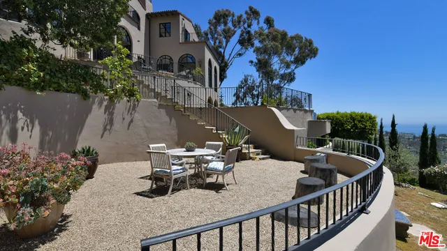 a view of swimming pool outdoor seating and city view