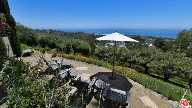 a view of a chairs and table in the patio