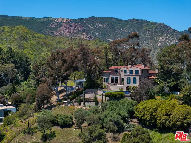 a view of a cafe with sitting area