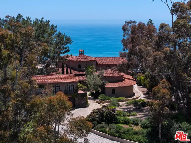 a front view of house with yard and outdoor seating