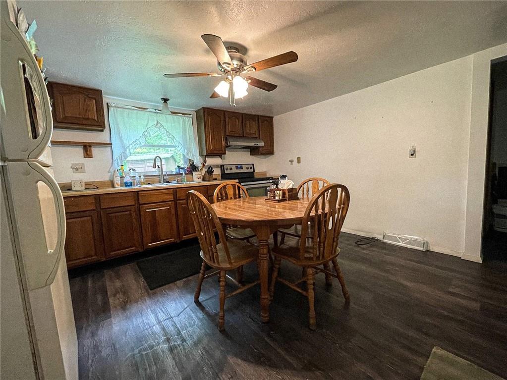 141 Minich Road Butler, PA 16001 - Photo 12 of 26 a dining room with furniture a window and wooden floor