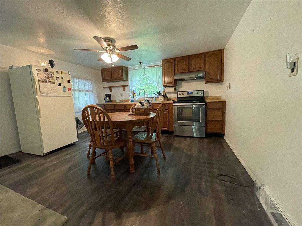 141 Minich Road Butler, PA 16001 - Photo 13 of 26 a view of a dining room with furniture wooden floor and a chandelier