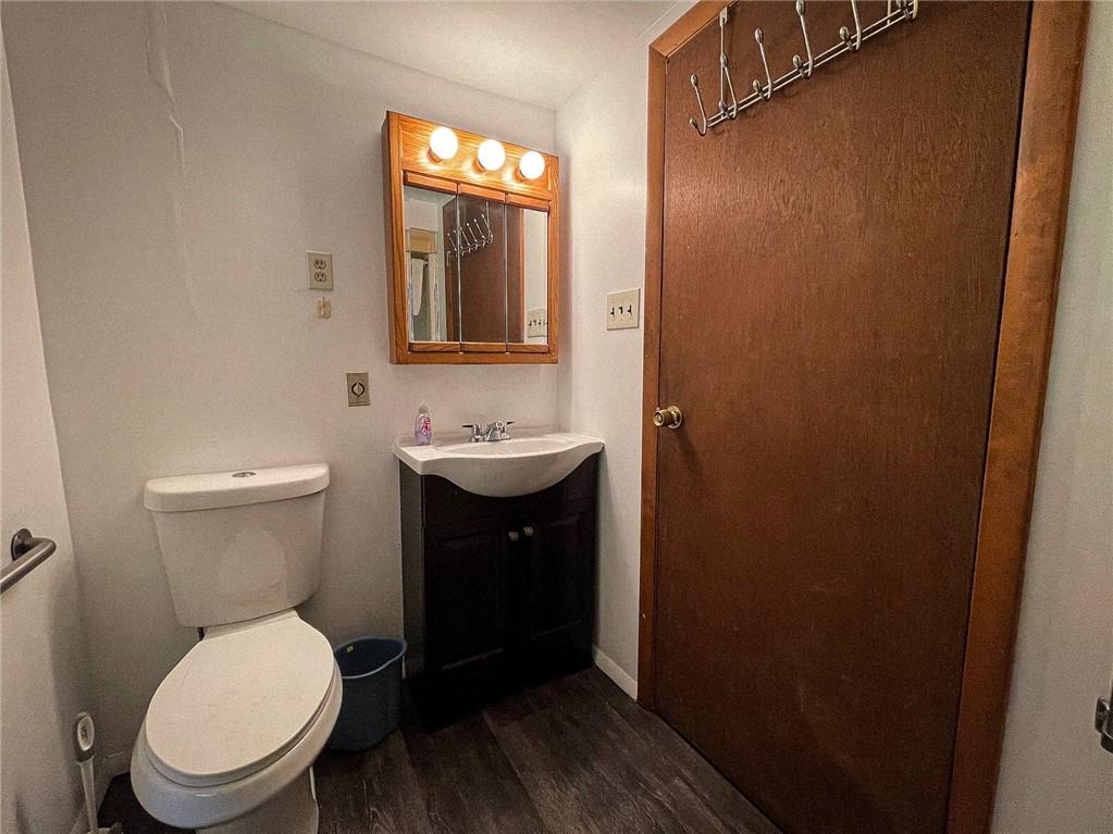 141 Minich Road Butler, PA 16001 - Photo 22 of 26 a bathroom with a toilet a sink and mirror