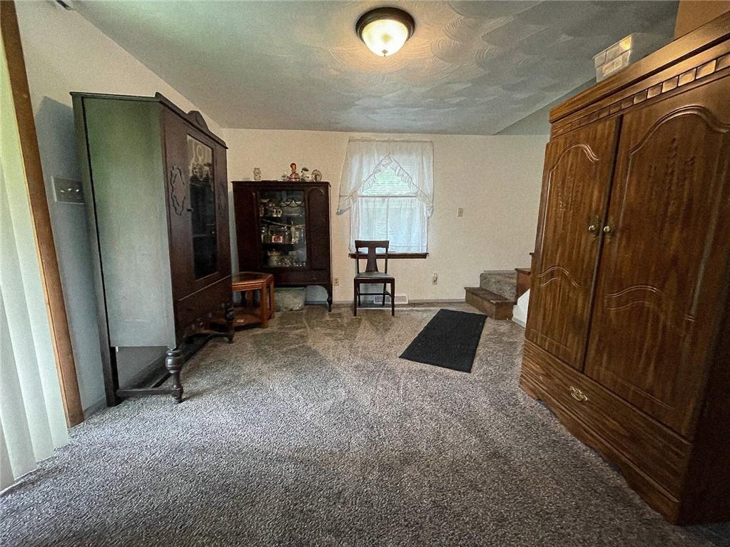 141 Minich Road Butler, PA 16001 - Photo 6 of 26 a view of a livingroom with furniture and a flat screen tv