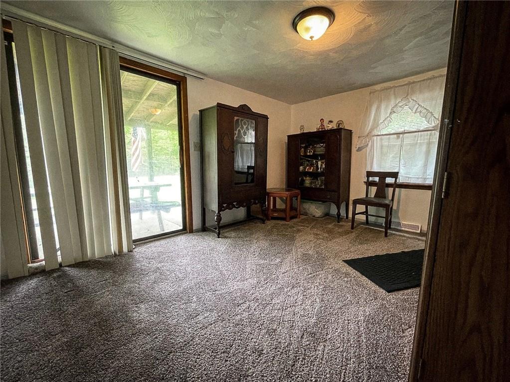 141 Minich Road Butler, PA 16001 - Photo 7 of 26 a view of livingroom with workspace and windows