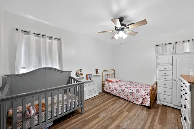 a bedroom with furniture and a window
