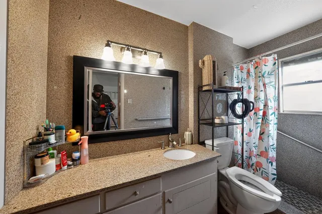 a bathroom with a sink double vanity and a mirror