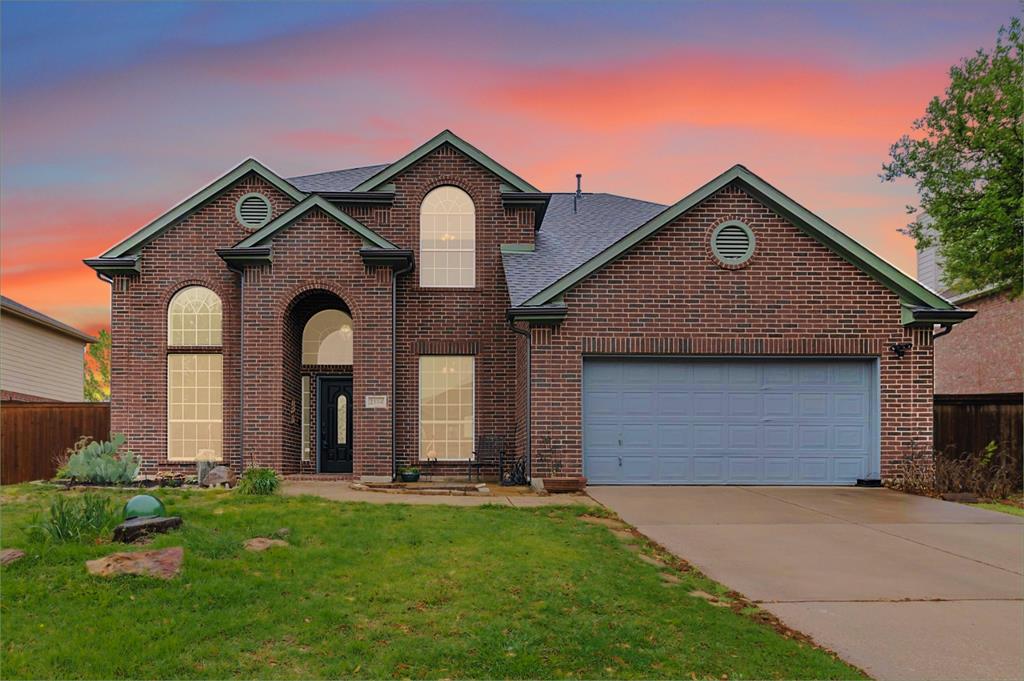 2104 Glen Manor Road Corinth, TX 76208 - Photo 1 of 1 a front view of a house with a yard and garage