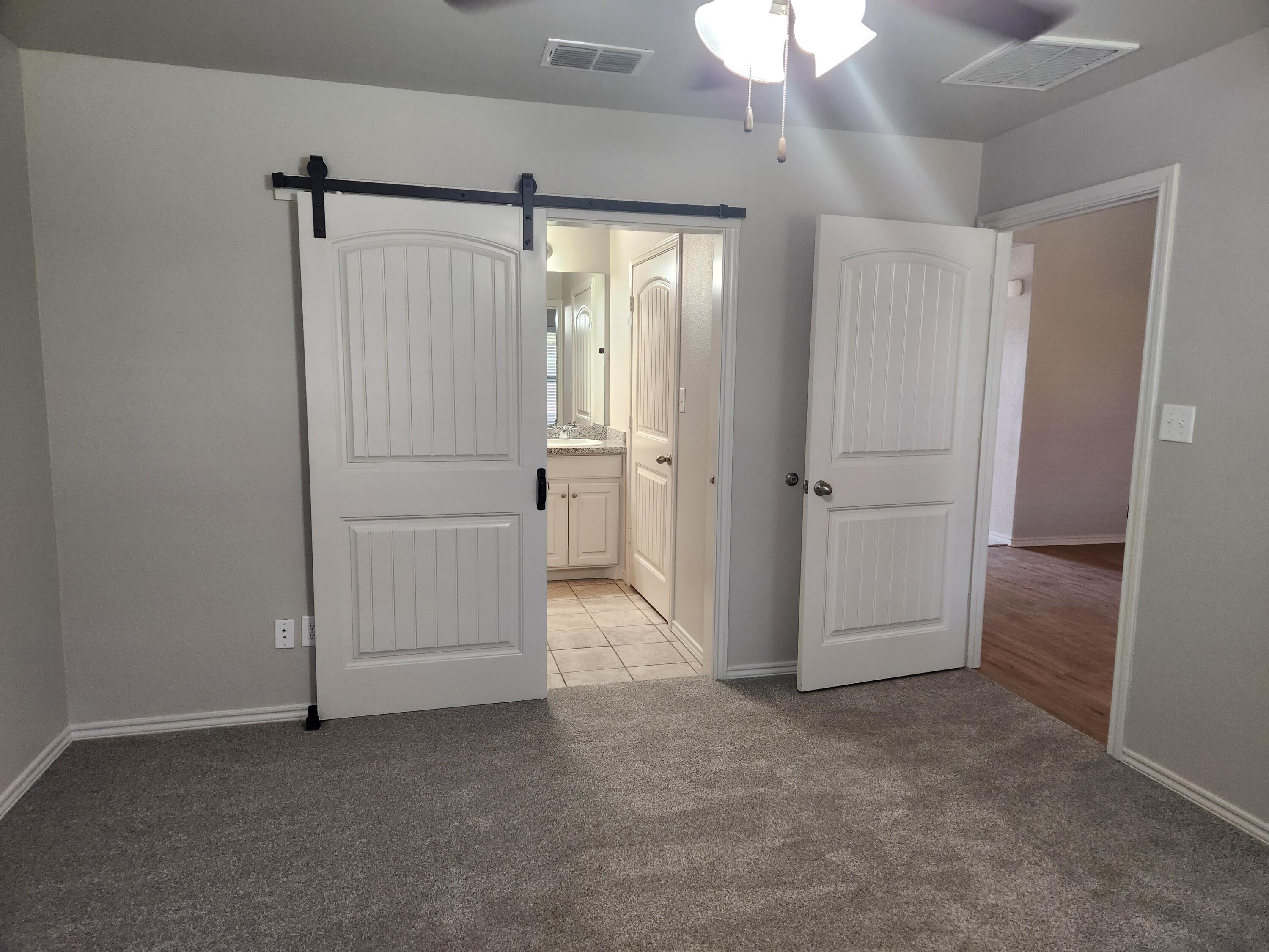 8702 13th Street Lubbock, TX 79416 - Photo 7 of 25 a view of an empty room