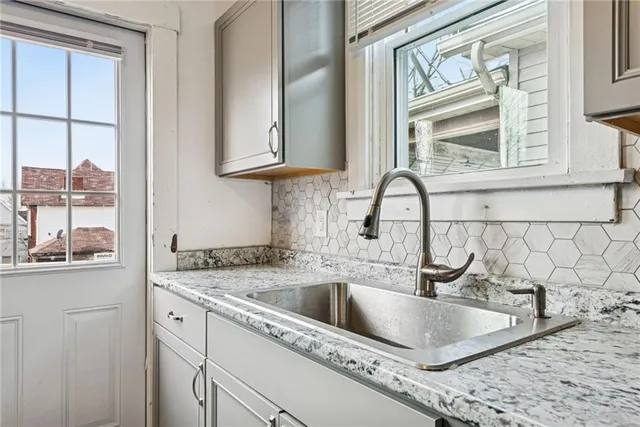 a kitchen with a sink and a window