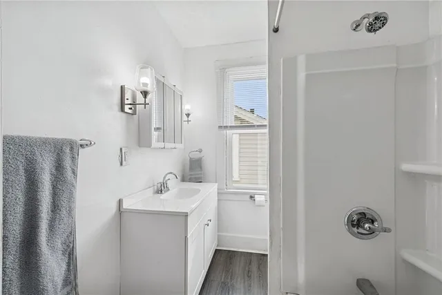 a bathroom with a sink and mirror