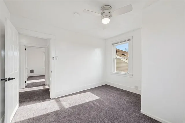 an empty room with a empty space and windows