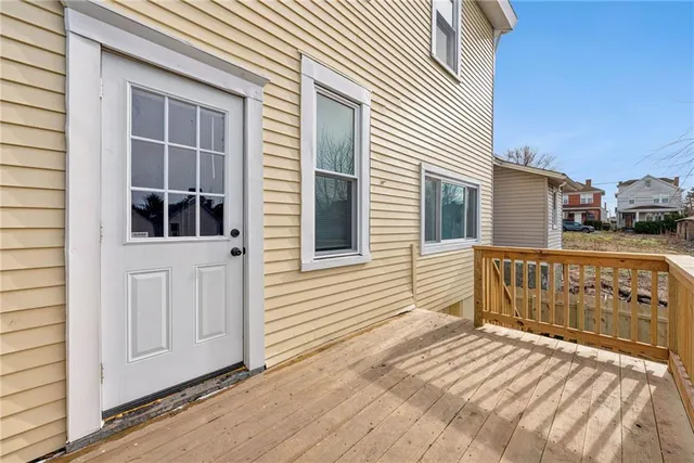 a view of a wooden house with a large window