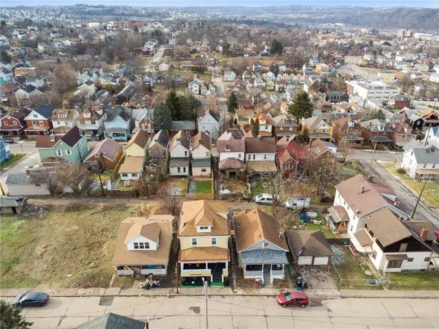 an aerial view of a building with lake view