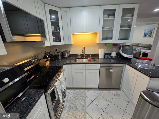 a bedroom with a bed and a chair