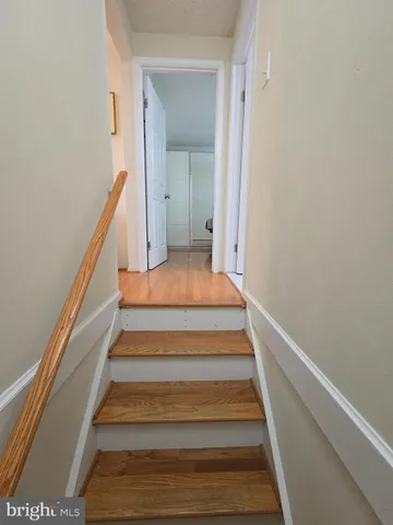 a bed room with a bed and a chandelier