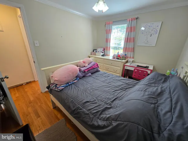 a bathroom with a sink a toilet and shower curtain