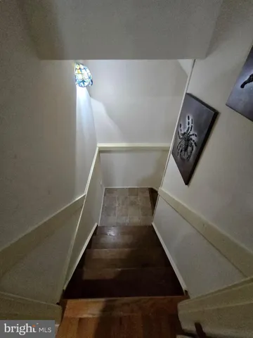 a view of deck with furniture and trees