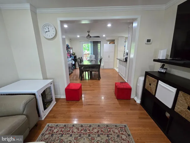 a kitchen with sink refrigerator and microwave