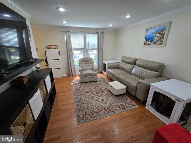 a kitchen with a refrigerator and a wooden cabinets