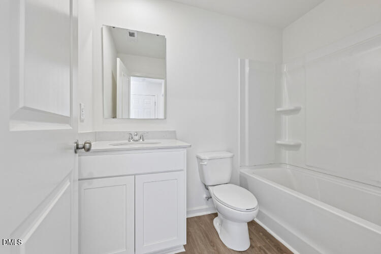10955 Lancaster Store Road Castalia, NC 27816 - Photo 4 of 20 a bathroom with a toilet sink vanity tub and shower