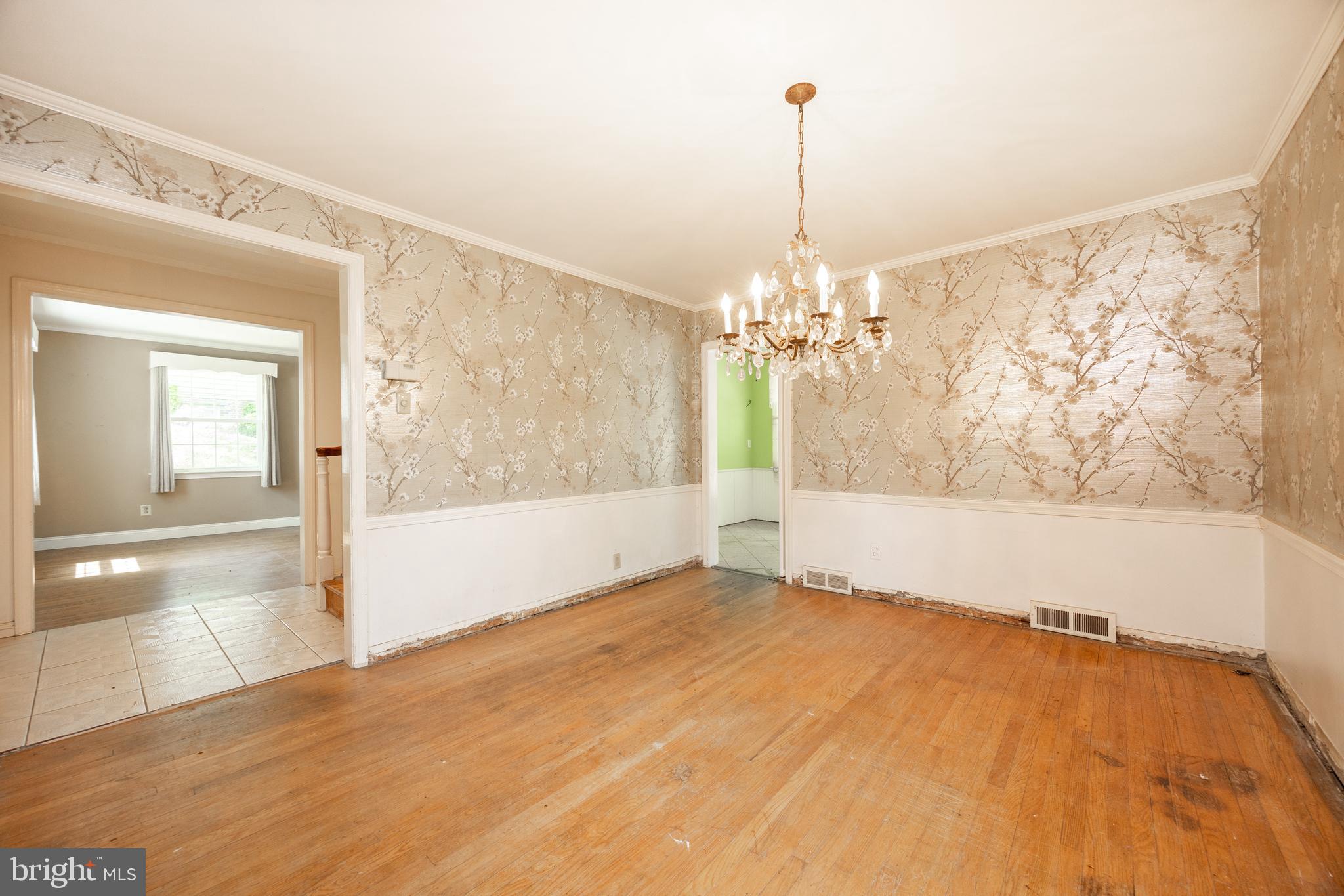 314 Spring Valley Road Springfield, PA 19064 - Photo 16 of 43 a view of a room with window wooden floor and a chandelier
