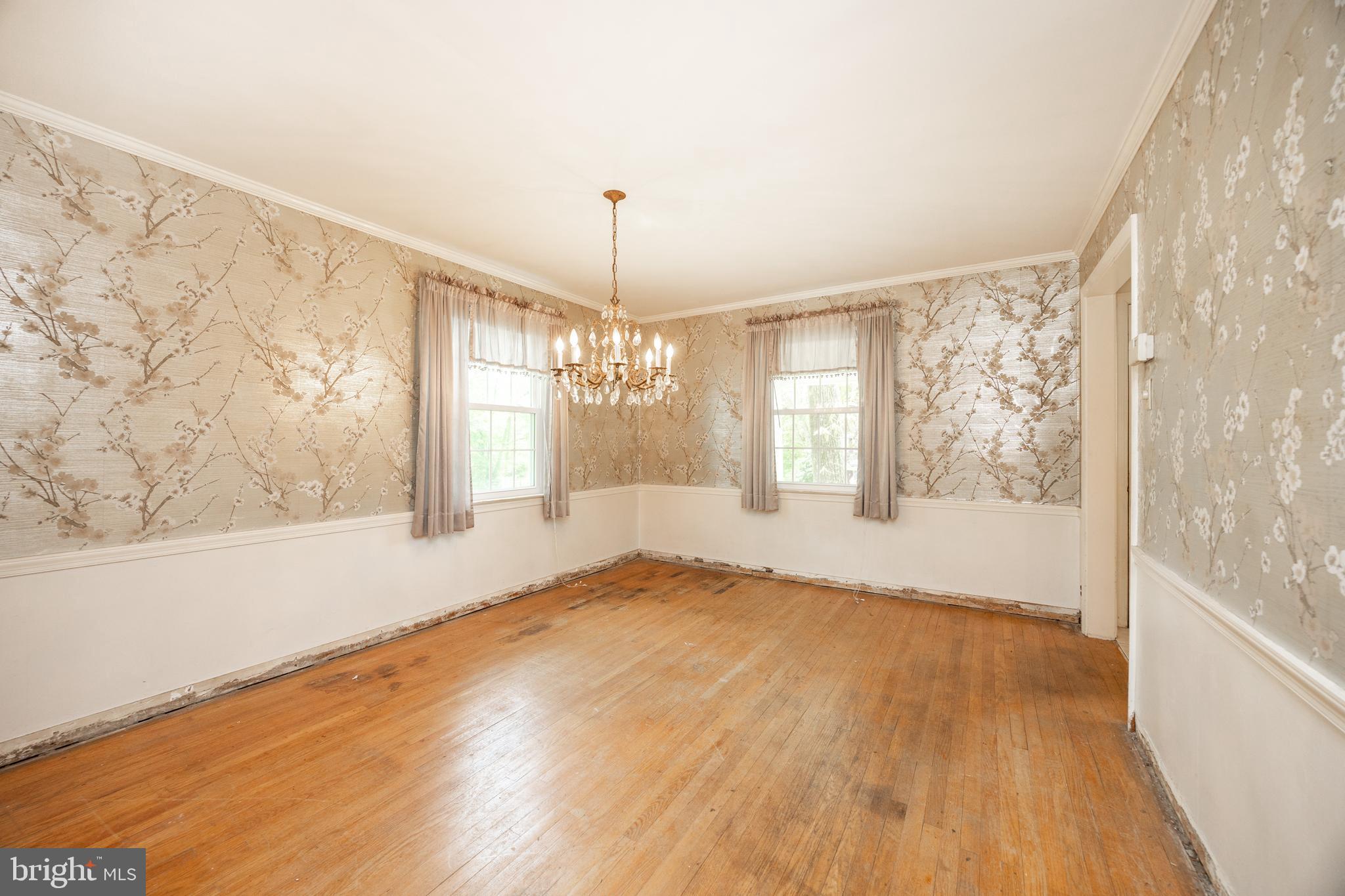 314 Spring Valley Road Springfield, PA 19064 - Photo 17 of 43 a view of an empty room with a window and wooden floor