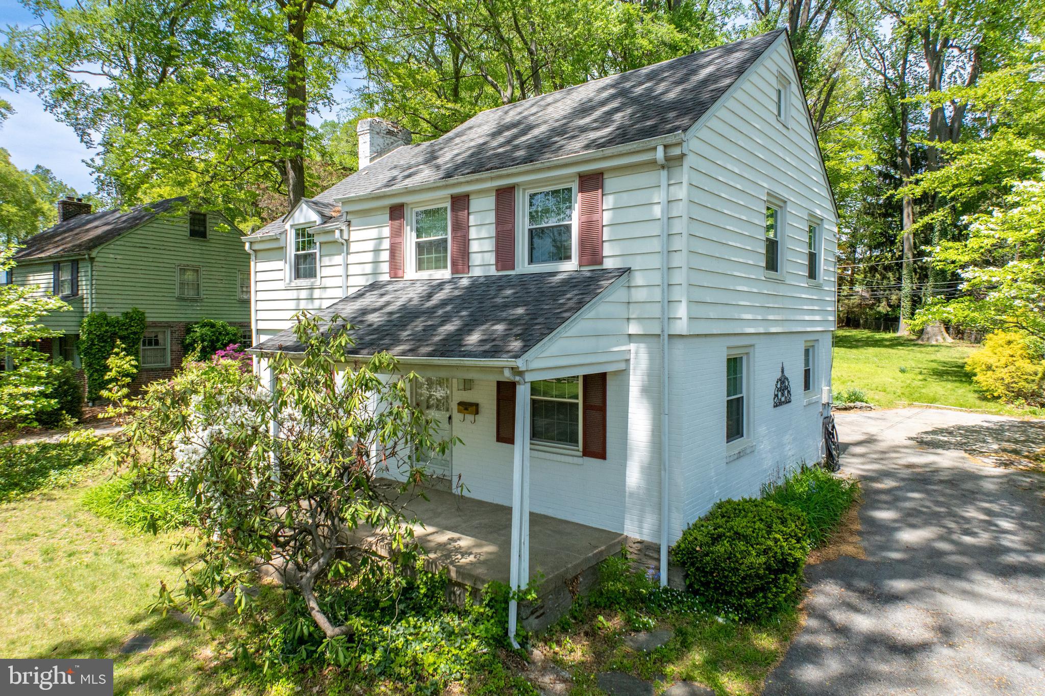 314 Spring Valley Road Springfield, PA 19064 - Photo 2 of 43 a front view of a house with a garden