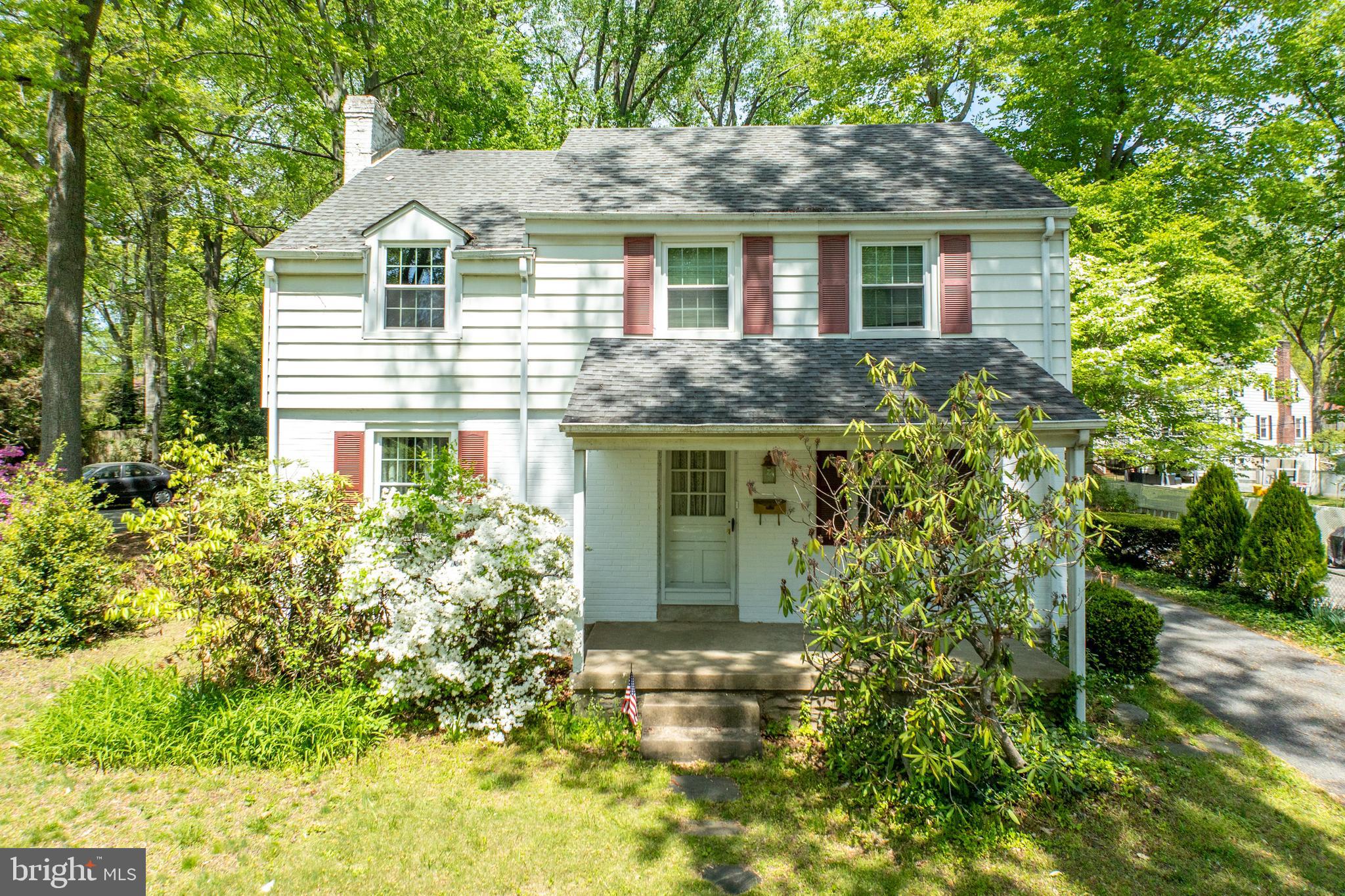 314 Spring Valley Road Springfield, PA 19064 - Photo 3 of 43 a front view of a house with a garden